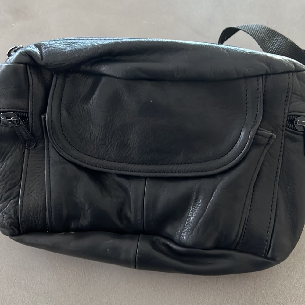 Like new black leather Fanny pack with multiple zippered compartments. - Picture 4 of 8